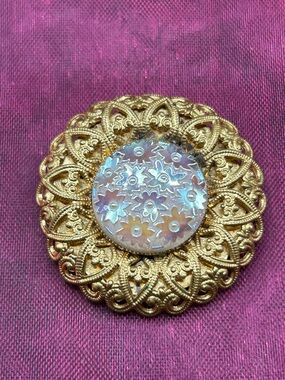 117 Gold Tone scarf ring iridescent floral middle
